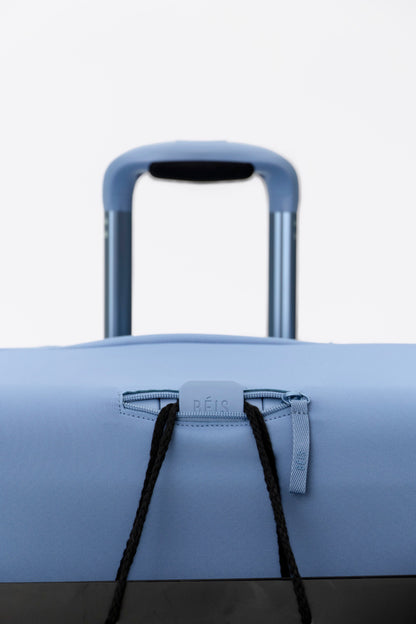 The Hybrid Check-In Luggage Cover in Dusty Blue
